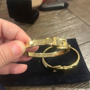 2 Michael kors bangle bracelets. Great condition  both gold, with some white